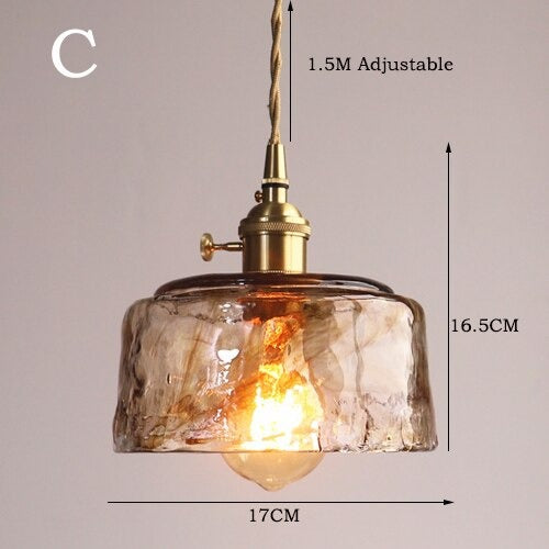 Hanglamp van messing en amberglas