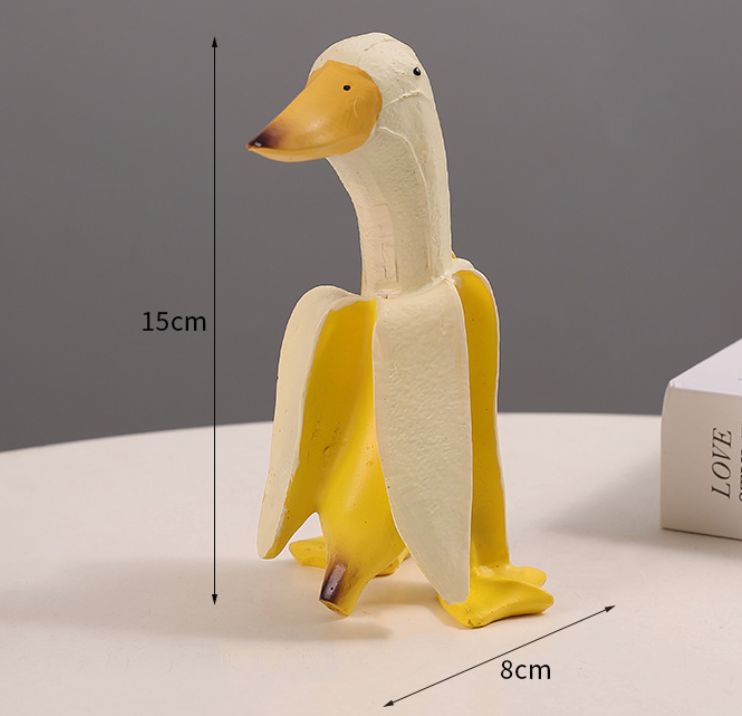 Escultura de pato bananero juguetón | Adorno de pato banana en miniatura de resina