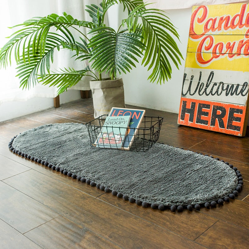 Pom-pom Trimmed Oval Anti-skid Rug