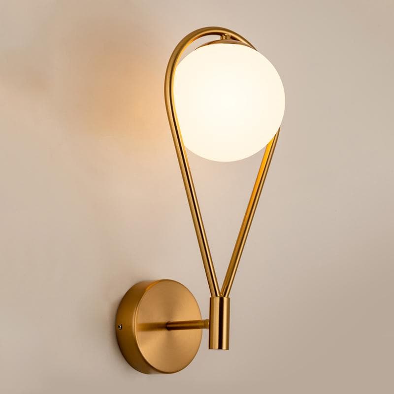 Loop Brass and Sphere Sconce