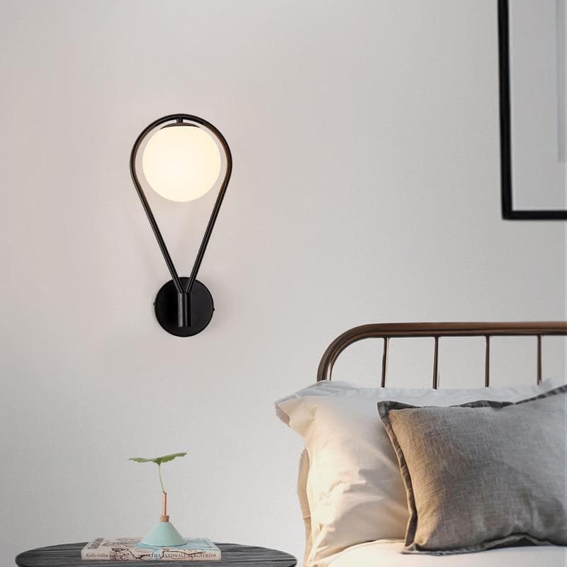 Loop Brass and Sphere Sconce