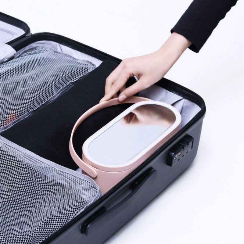 Travel makeup organizer with integrated LED mirror